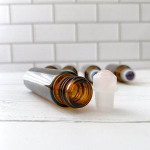 10 count 10ml empty amber essential oil bottles w/ rose quartz roller balls.